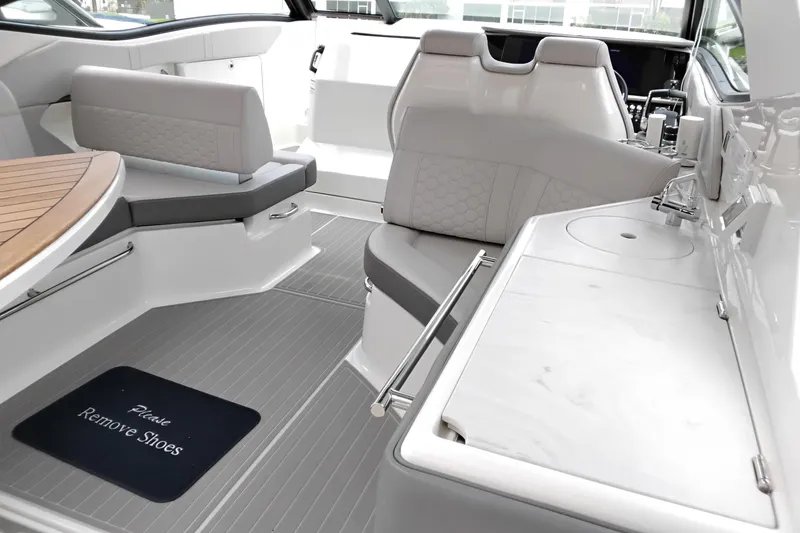 Slide: The Image of Luxurious interior of 2023 Sea Ray Sundancer 320 Outboard with seating and kitchenette. - 17