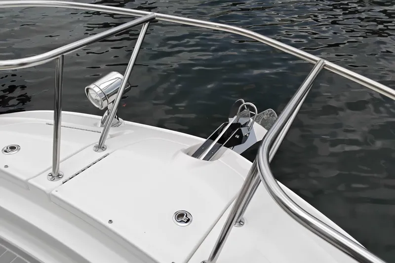 Slide: The Image of Bow of 2023 Sea Ray Sundancer 320 Outboard with stainless steel railings and anchor. - 22