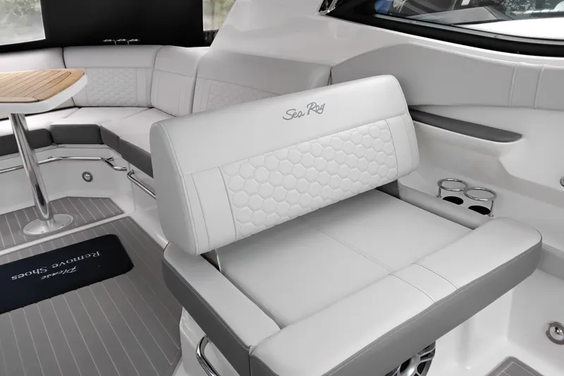 Slide: The Image of Luxurious interior of 2023 Sea Ray Sundancer 320 Outboard with elegant seating and table. - 8