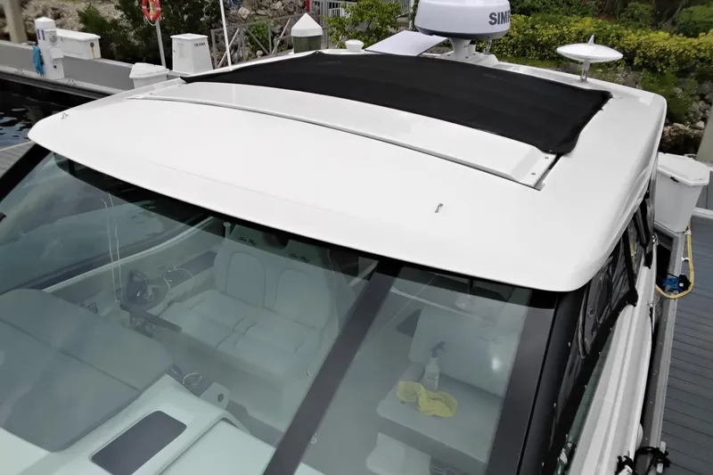 Slide: The Image of 2023 Sea Ray Sundancer 320 Outboard with sleek design and spacious cockpit view. - 25