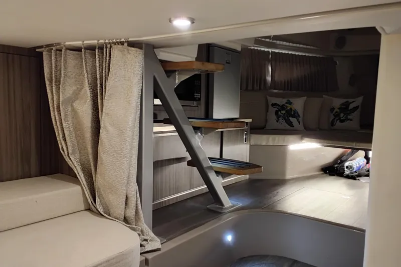 Slide: The Image of 2023 Sea Ray Sundancer 320 Outboard interior with modern design and cozy seating area. - 31
