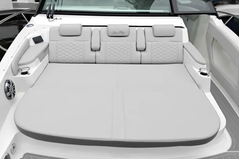 Slide: The Image of 2023 Sea Ray Sundancer 320 Outboard boat with luxurious rear seating and cup holders. - 21