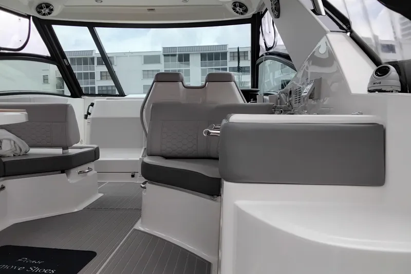 Slide: The Image of Interior of 2023 Sea Ray Sundancer 320 Outboard, featuring modern seating and sleek design. - 41