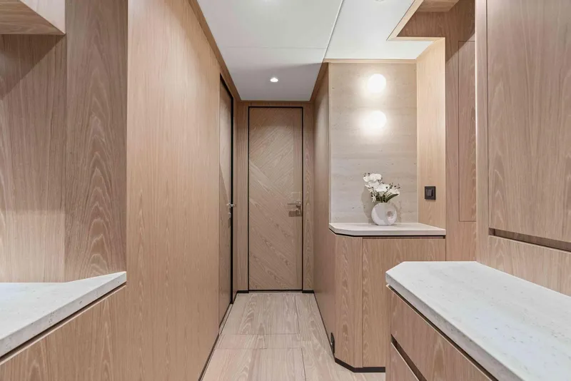Slide: The Image of Luxurious wooden interior hallway of 2026 Horizon FD100 yacht, featuring modern design and elegant decor. - 21