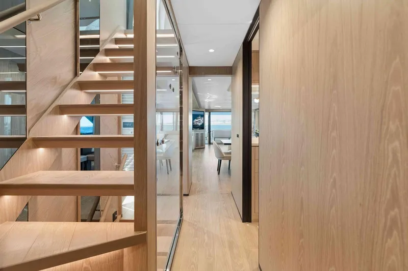 Slide: The Image of Modern interior of 2026 Horizon FD100 yacht with wooden staircase and sleek design. - 12