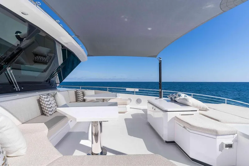 Slide: The Image of Luxurious Horizon FD100 yacht deck with seating, table, and ocean view, 2026 model. - 41