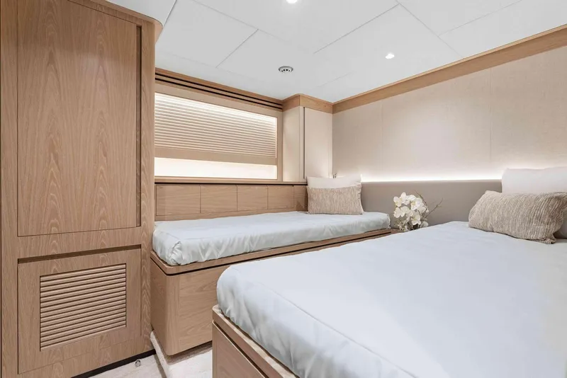 Slide: The Image of Luxurious twin bedroom in 2026 Horizon FD100 yacht, featuring modern design and elegant decor. - 20