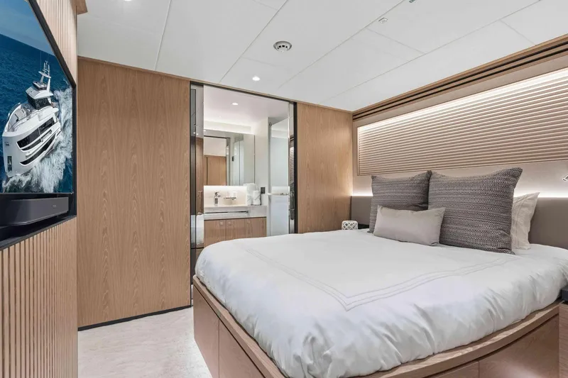 Slide: The Image of Luxurious bedroom interior on Horizon FD100 yacht, featuring modern design and elegant furnishings, 2026 model. - 24