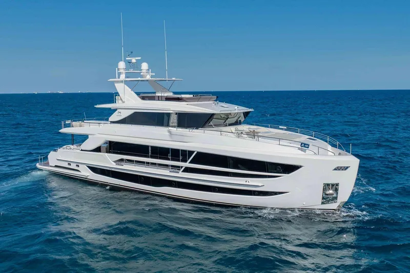 Slide: The Image of Luxurious 2026 Horizon FD100 yacht cruising on open sea under clear blue sky. - 44