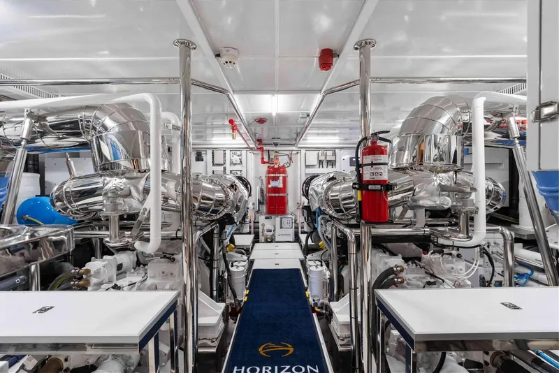 Slide: The Image of Engine room of Horizon FD100 yacht, featuring advanced machinery and polished metal components, 2026 model. - 43
