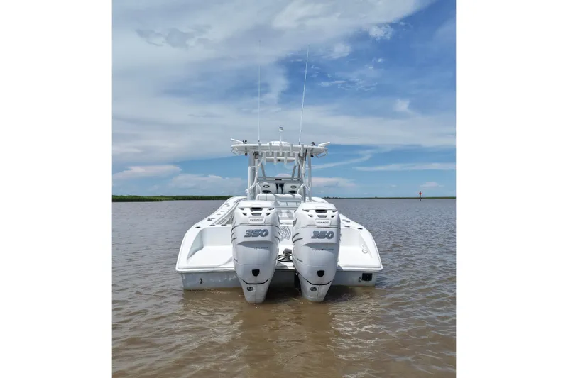 Slide: The Image of 2016 Yellowfin 32 Offshore boat with twin 350 engines on calm water. - 12