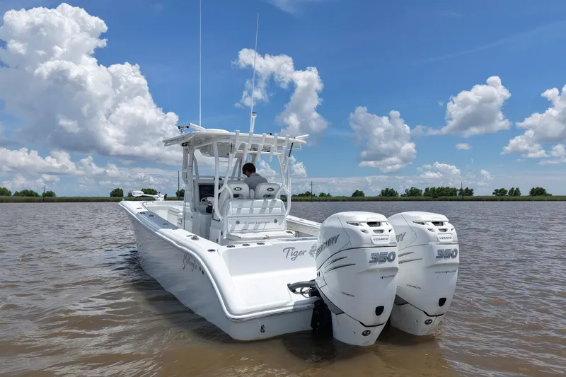 Slide: The Image of 2016 Yellowfin 32 Offshore boat with twin Mercury 350 engines on a sunny day. - 11