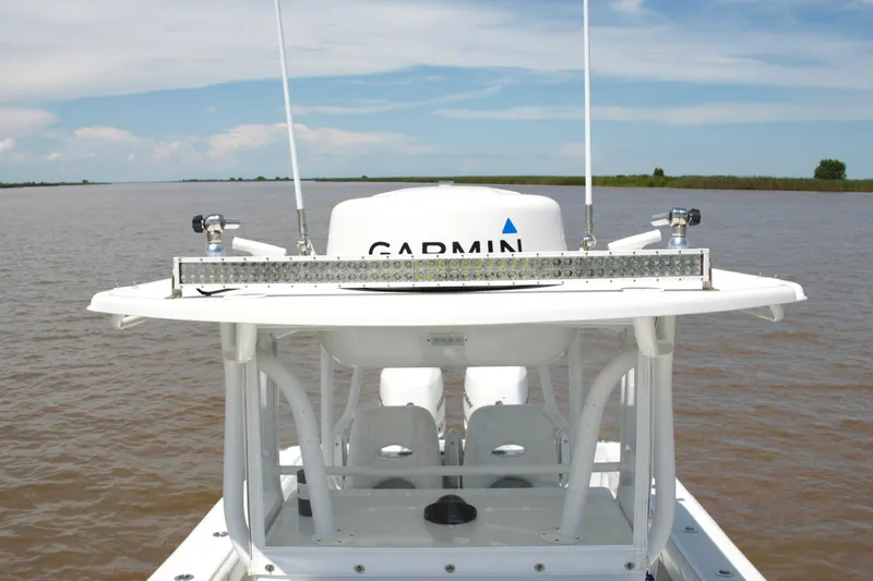 Slide: The Image of 2016 Yellowfin 32 Offshore boat with Garmin equipment on calm waters. - 26