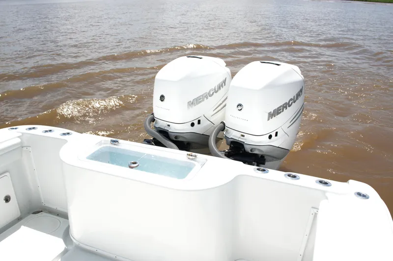 Slide: The Image of 2016 Yellowfin 32 Offshore boat with dual Mercury outboard engines on water. - 37