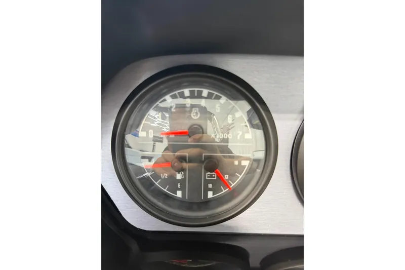 Slide: The Image of Close-up of 2019 MasterCraft NXT22 dashboard gauge, showing RPM and fuel levels. - 28