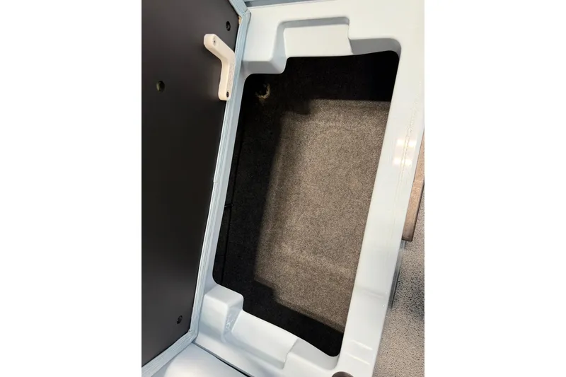 Slide: The Image of Storage compartment of 2019 MasterCraft NXT22 boat, featuring a spacious interior. - 24