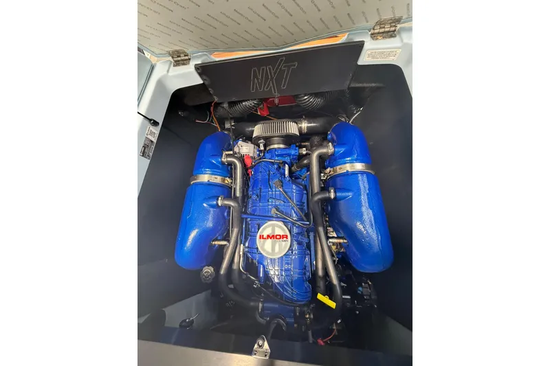 Slide: The Image of 2019 MasterCraft NXT22 engine compartment with blue Ilmor engine components. - 16