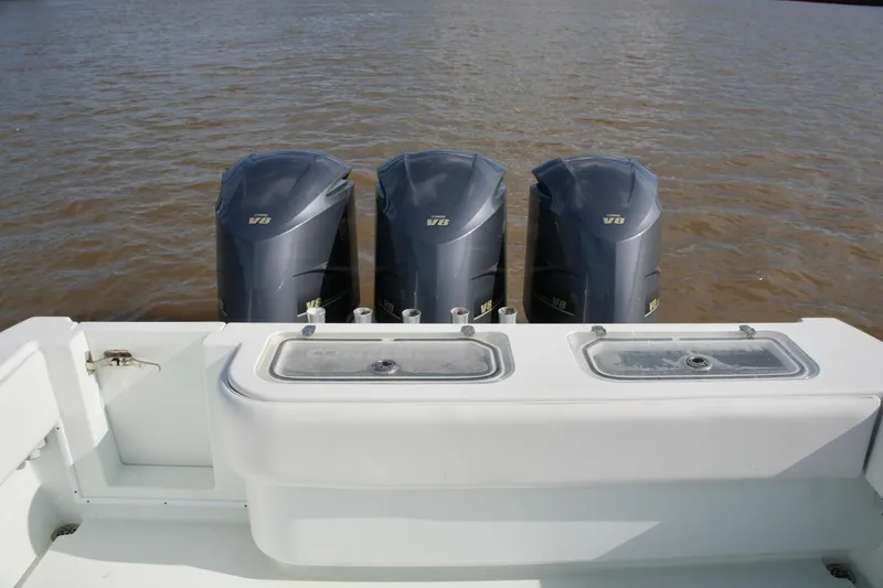 Slide: The Image of 2013 Contender 39 ST boat with triple V8 engines on water. - 18