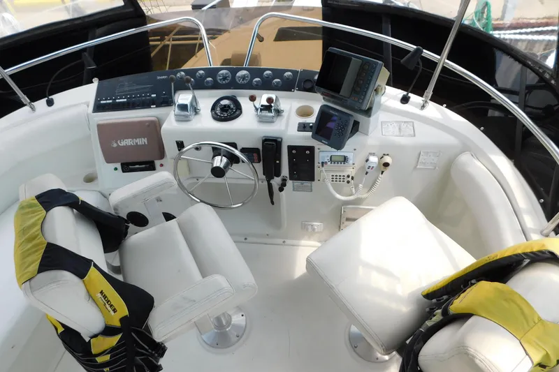 Slide: The Image of Cockpit of 1992 Silverton 41 Aft Cabin with navigation equipment and seating. - 31
