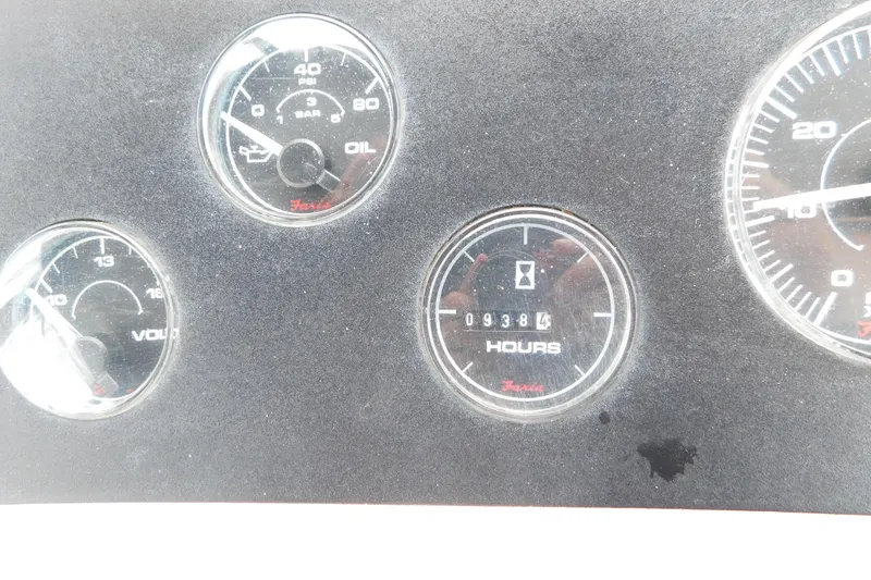 Slide: The Image of Instrument panel of a 1992 Silverton 41 Aft Cabin boat showing gauges and hour meter. - 25