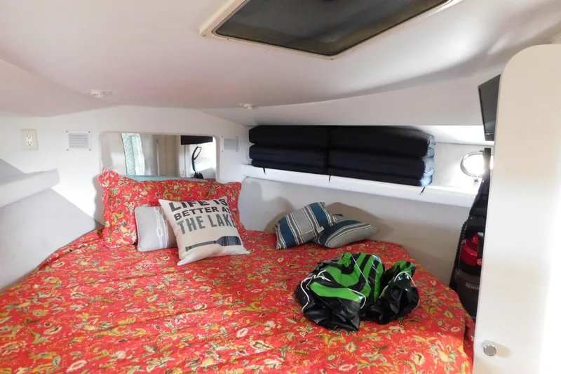 Slide: The Image of Cozy cabin interior of 1992 Silverton 41 Aft Cabin with floral bedding and decorative pillows. - 77