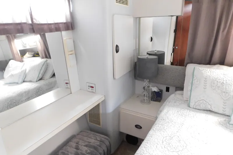 Slide: The Image of Cozy bedroom interior of 1992 Silverton 41 Aft Cabin with elegant decor and soft lighting. - 113