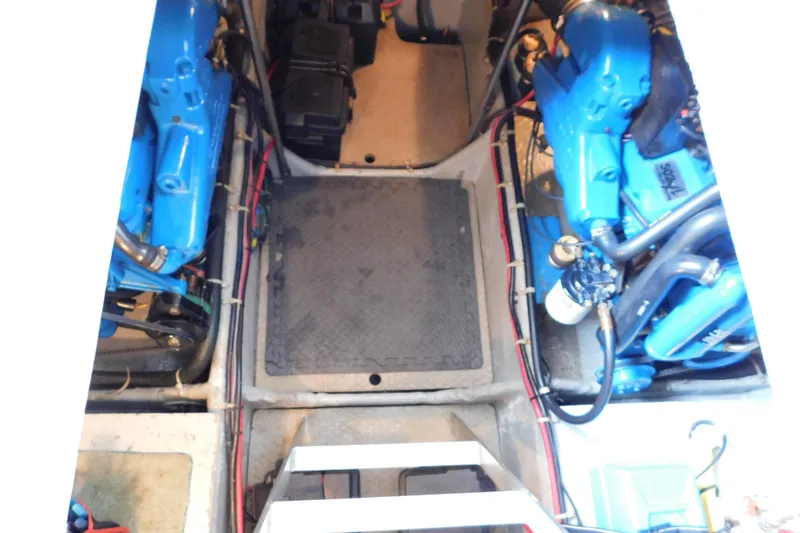 Slide: The Image of Engine room of 1992 Silverton 41 Aft Cabin with blue engines and wiring. - 87