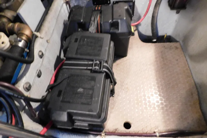 Slide: The Image of Battery compartment of a 1992 Silverton 41 Aft Cabin boat, featuring secured wiring. - 94