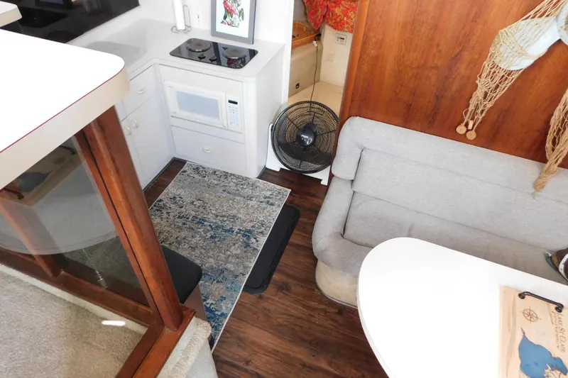 Slide: The Image of Interior of 1992 Silverton 41 Aft Cabin with kitchenette and seating area. - 58