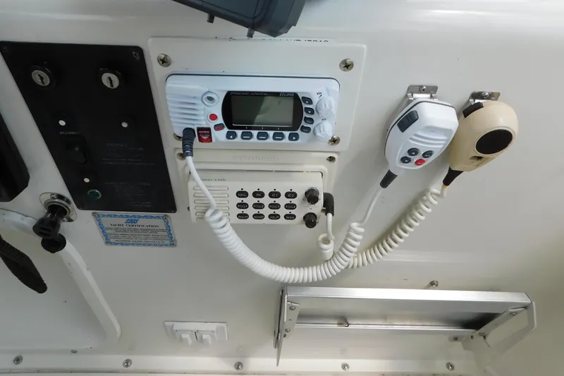 Slide: The Image of Control panel of a 1992 Silverton 41 Aft Cabin yacht with communication equipment. - 23