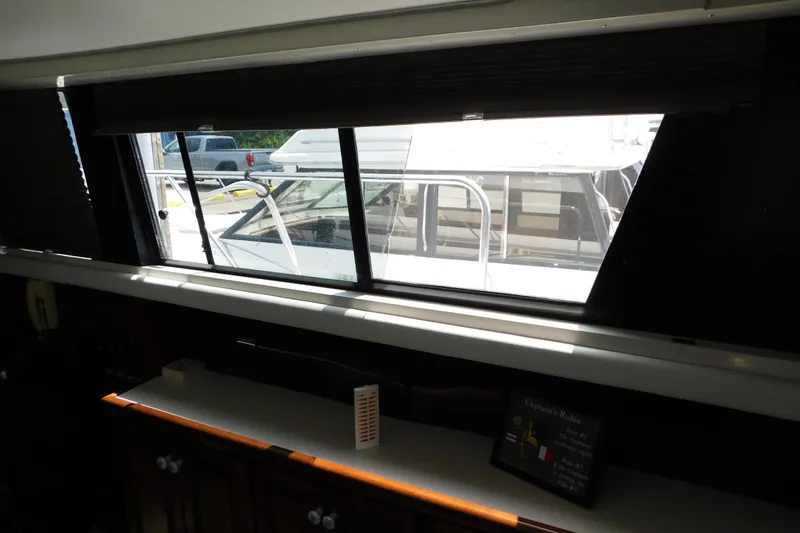 Slide: The Image of Interior view from a 1992 Silverton 41 Aft Cabin yacht, showcasing window and exterior. - 46