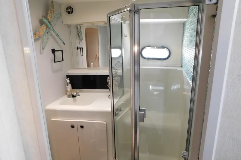 Slide: The Image of Bathroom interior of 1992 Silverton 41 Aft Cabin yacht with shower and vanity. - 71