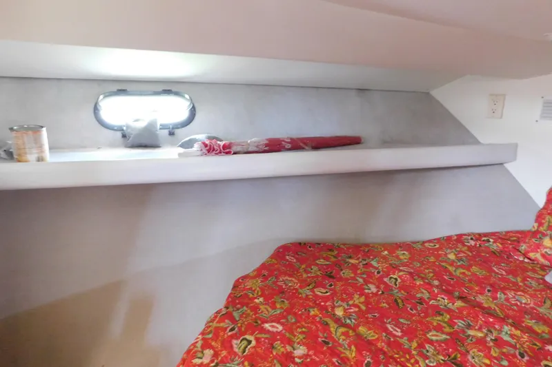Slide: The Image of Interior of 1992 Silverton 41 Aft Cabin with floral bedding and shelf. - 80