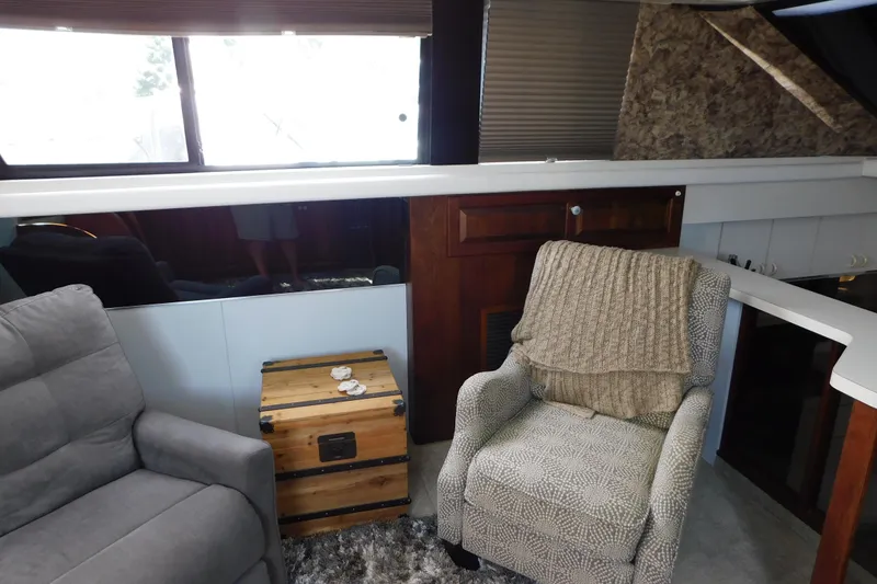 Slide: The Image of Interior of 1992 Silverton 41 Aft Cabin with cozy seating and wooden accents. - 51