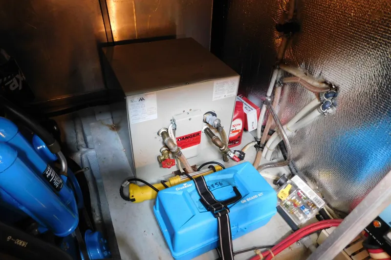 Slide: The Image of Engine room of a 1992 Silverton 41 Aft Cabin with equipment and wiring. - 89