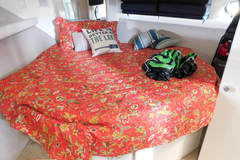 Slide: The Image of Cozy cabin interior of 1992 Silverton 41 Aft Cabin with floral bedding and decorative pillows. - 76