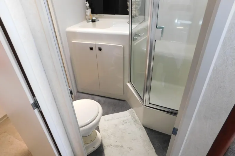 Slide: The Image of Bathroom in 1992 Silverton 41 Aft Cabin yacht with shower, sink, and toilet. - 70