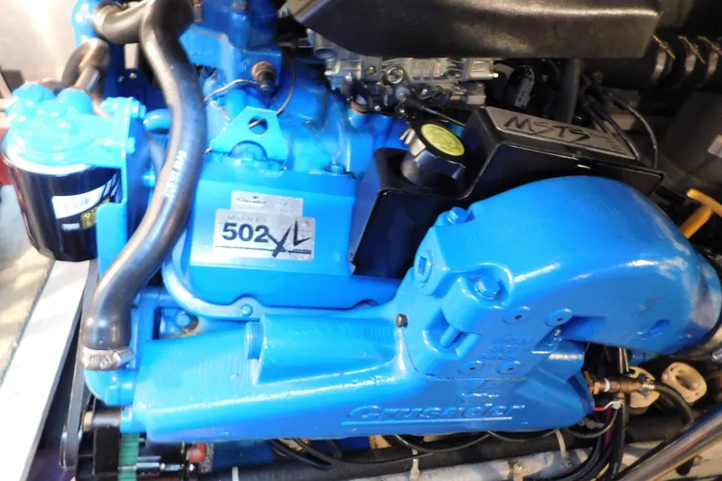 Slide: The Image of Engine of a 1992 Silverton 41 Aft Cabin boat, featuring a blue Crusader 502XL. - 92
