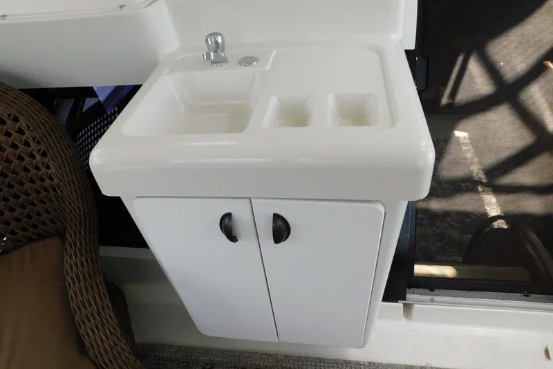 Slide: The Image of White sink and cabinet on a 1992 Silverton 41 Aft Cabin yacht. - 40