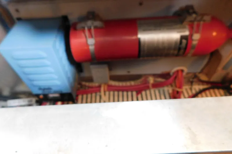 Slide: The Image of Engine compartment of a 1992 Silverton 41 Aft Cabin with fire extinguisher and wiring. - 88