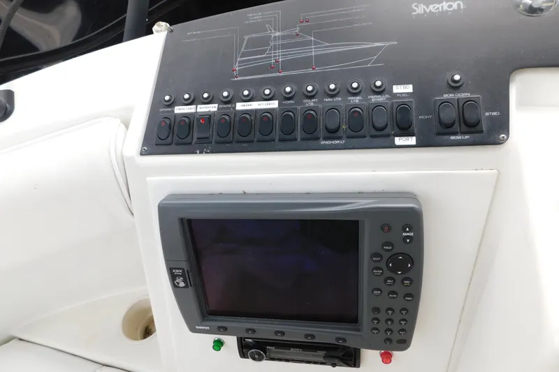 Slide: The Image of Control panel of a 1992 Silverton 41 Aft Cabin yacht with navigation equipment. - 26