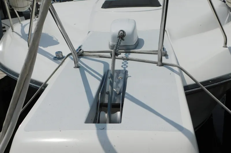 Slide: The Image of Bow of 1992 Silverton 41 Aft Cabin yacht with anchor chain and railing. - 3