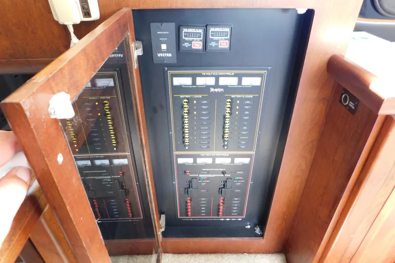 Slide: The Image of Electrical control panel inside a 1992 Silverton 41 Aft Cabin boat. - 52