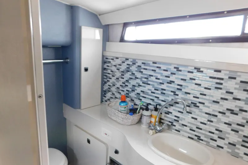 Slide: The Image of Bathroom interior of 1992 Silverton 41 Aft Cabin with mosaic tile backsplash. - 107