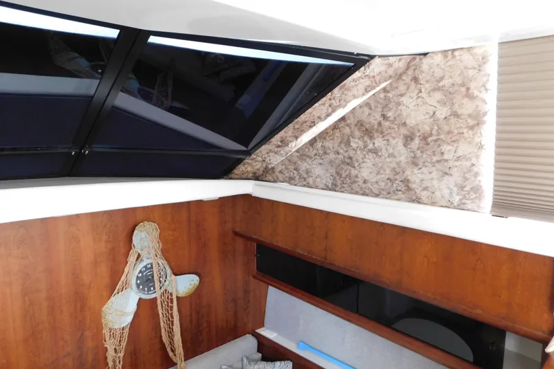 Slide: The Image of Interior of 1992 Silverton 41 Aft Cabin with nautical decor and skylight. - 56