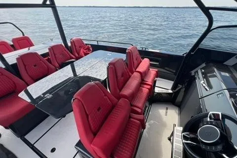 Slide: The Image of 2021 BRABUS 900 Shadow boat with luxurious red seating on open water. - 20
