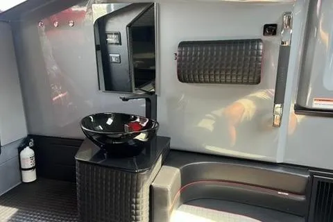 Slide: The Image of Interior of 2021 BRABUS 900 Shadow featuring sleek black sink and modern design elements. - 23