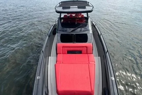 Slide: The Image of 2021 BRABUS 900 Shadow yacht with sleek design and vibrant red seating on open water. - 15