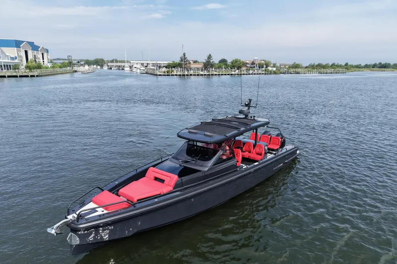 Slide: The Image of Luxury 2021 BRABUS 900 Shadow yacht with red seating on a serene waterway. - 8