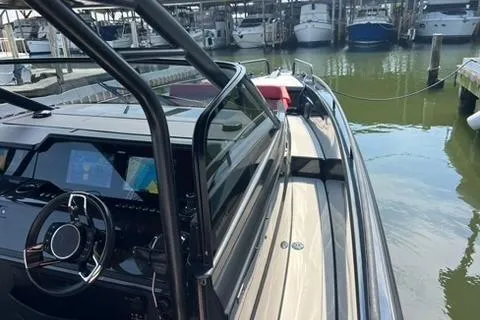 Slide: The Image of 2021 BRABUS 900 Shadow luxury boat docked, showcasing sleek design and advanced cockpit features. - 37